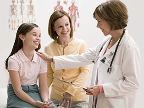 A mom and her daughter at the doctor's office.